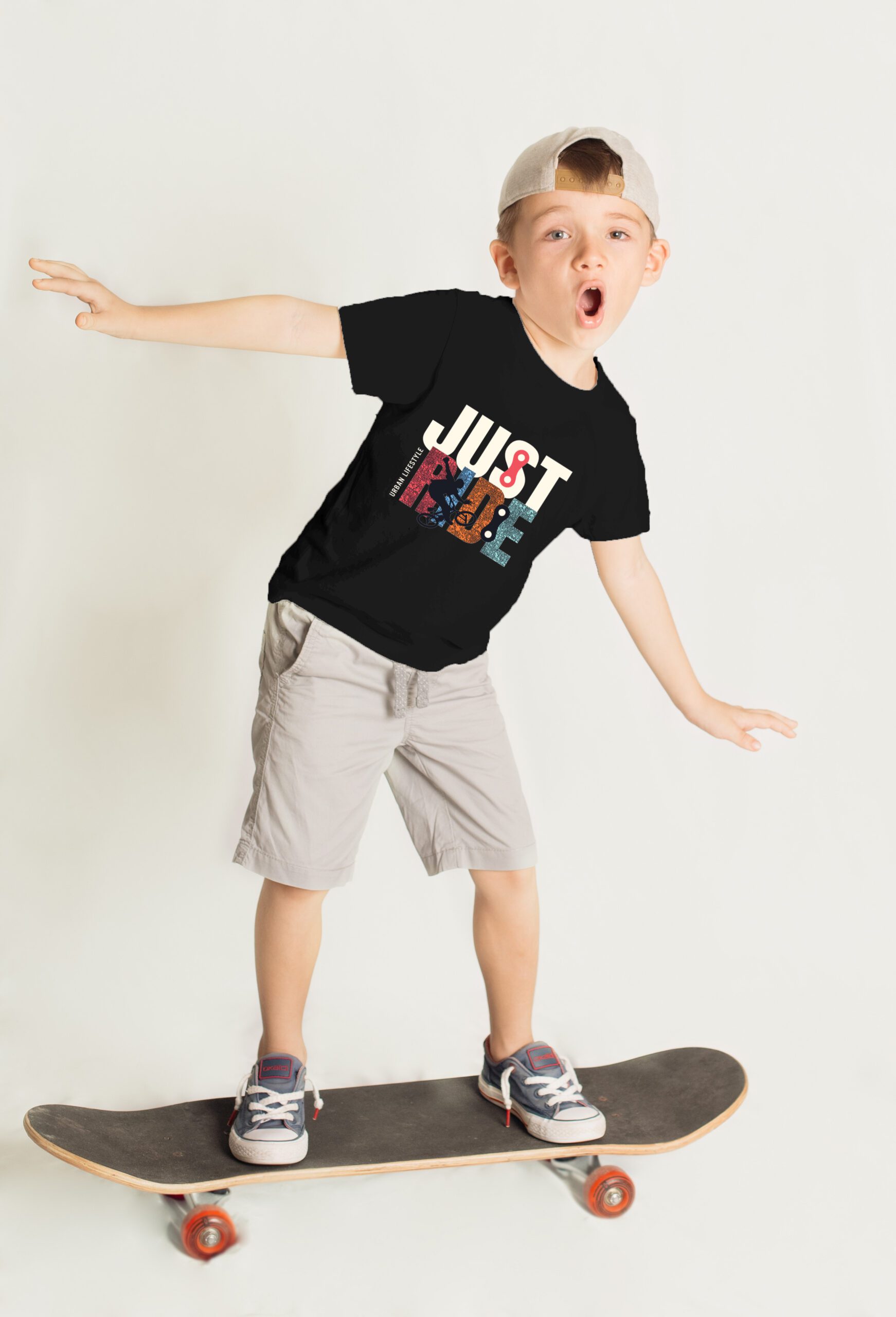 little boy skateboarding